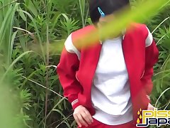 A girl in her red tracksuit squats to sit on a low wall by the curb. She checks to see anyone watching then pulls he pants to her knees and lets a stream of hot piss fly out from between her smooth thick lips. She takes the moment to finger her buzzing pussy and spurts out more piss while she pleasures herself.rnrnIt all feels so irresistibly good that she can't help pulling up her t-shirt to play with her breasts then taking off her pants. She props her legs on the wall and fingers herself to a quaking climax. Her pretty face contorts into a lip-biting expression of uncontrolled lust as she squeezes her thighs tight around her frigging hand. She discreetly wipes her hand and crack with a tissue and dresses before she walks away.